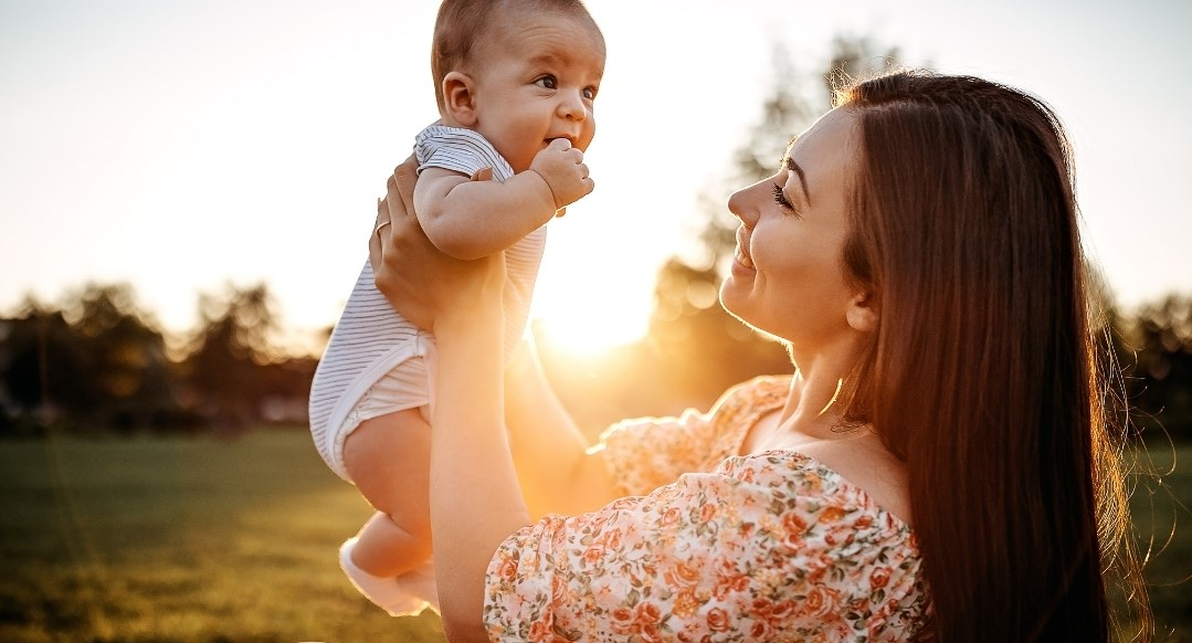 Woman and child smiling at each other